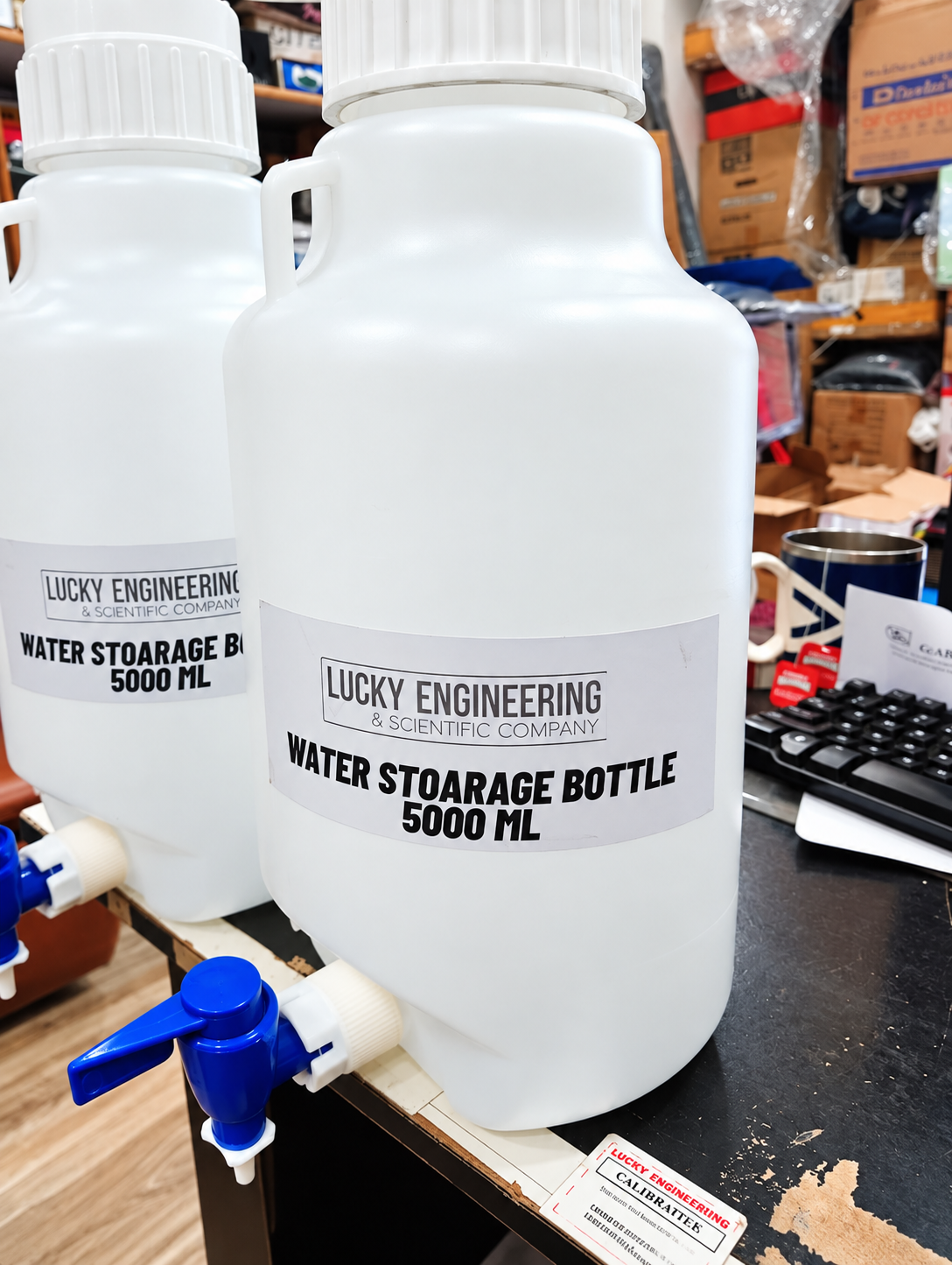 Water Storage Bottle 5000 ML with durable plastic construction and dispensing tap. Ideal for laboratories, hospitals, industrial facilities, home and outdoor use.