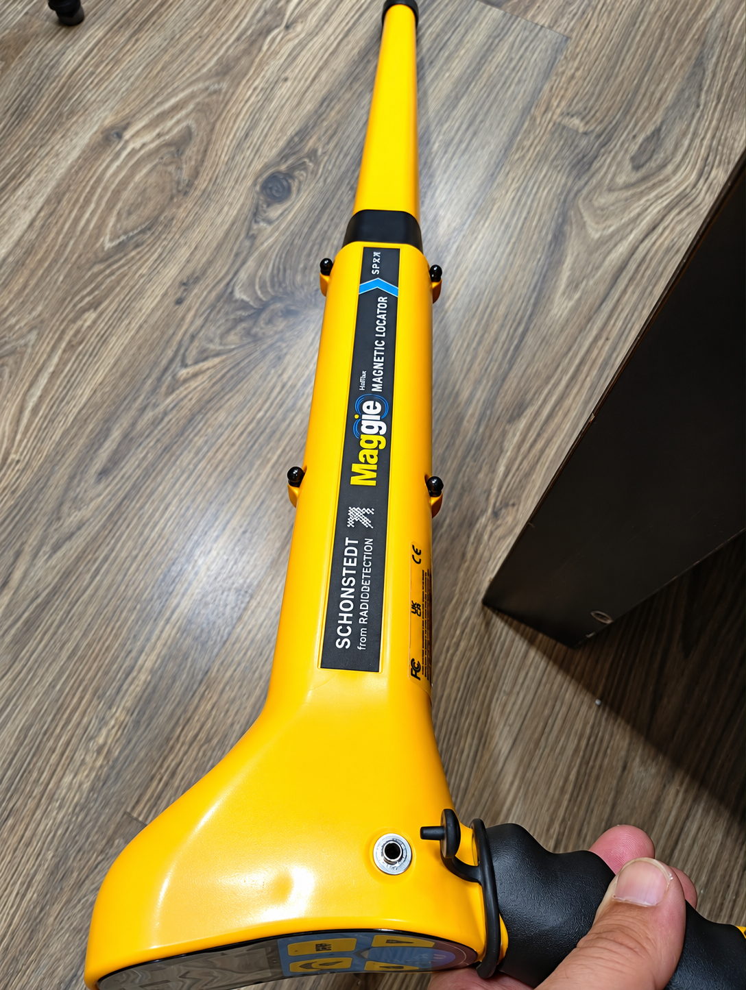 Yellow Schonstedt Maggie Magnetic Locatoron Wood Floo