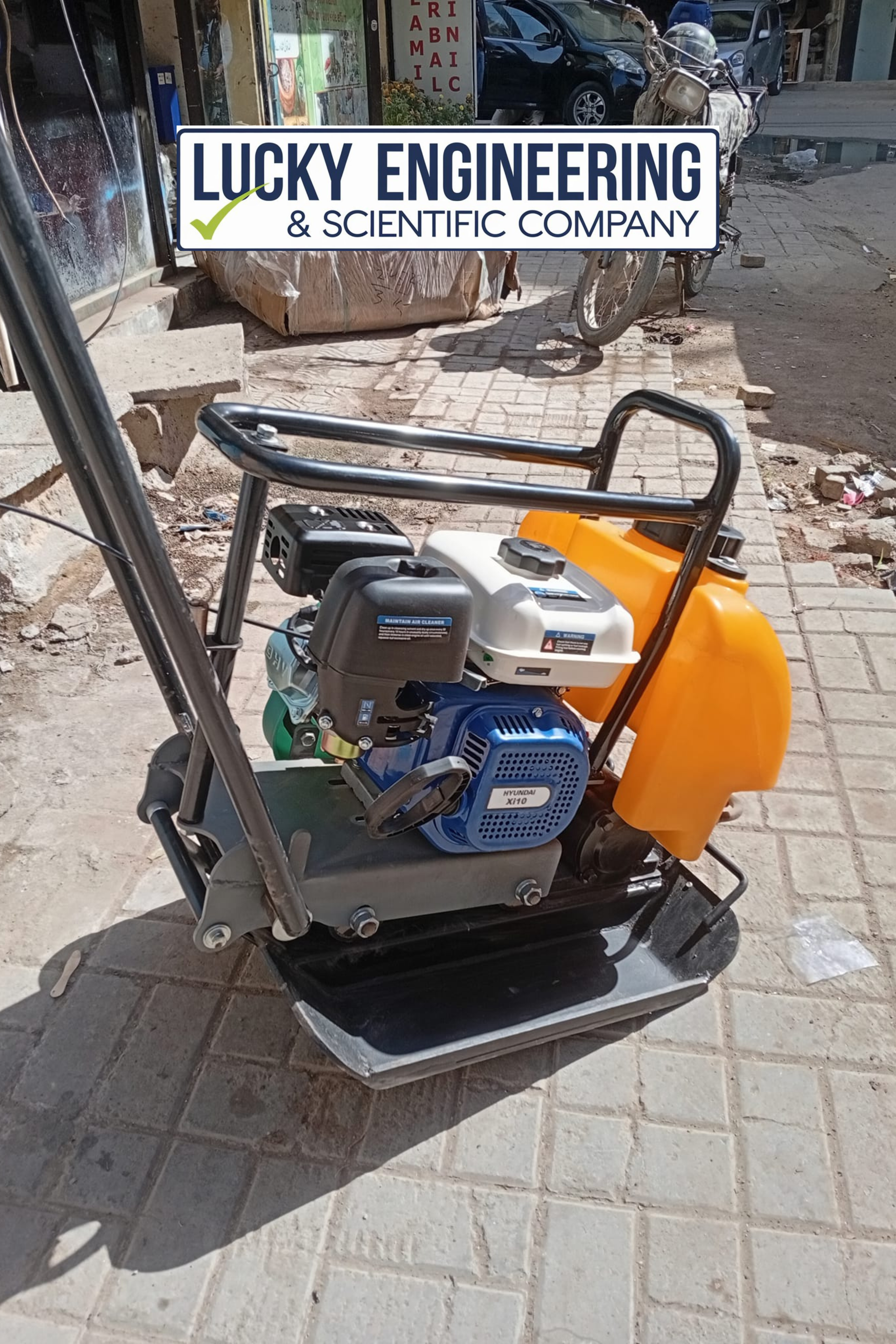 Vibratory Plate Compactor compacting soil for road construction